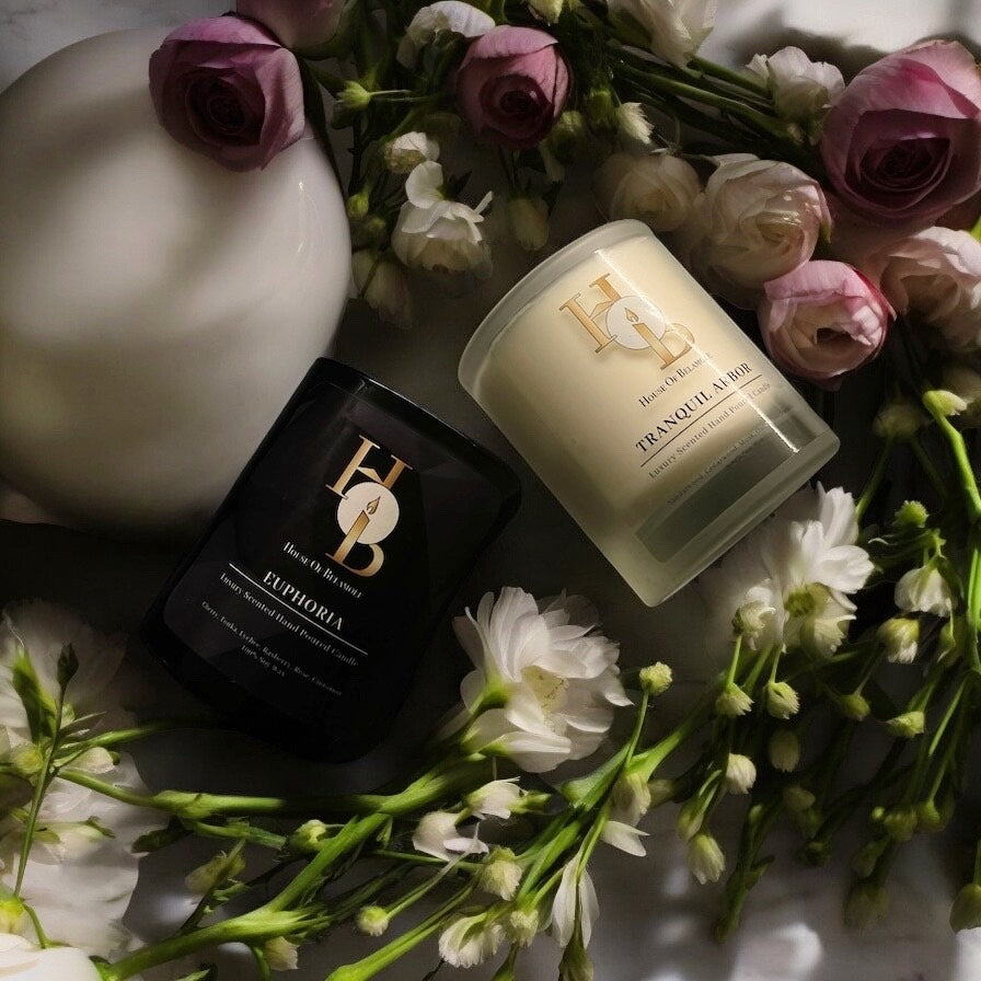 Luxury 2-wick soy candles with floral woody and fruity spicy scent notes, styled to highlight sophisticated home interiors and showcase calming home fragrance as part of elevated decor.