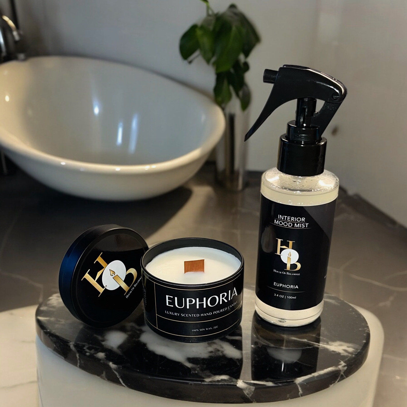 Unique Room Mist and Scented Candle on a marble countertop in a Luxury bathroom