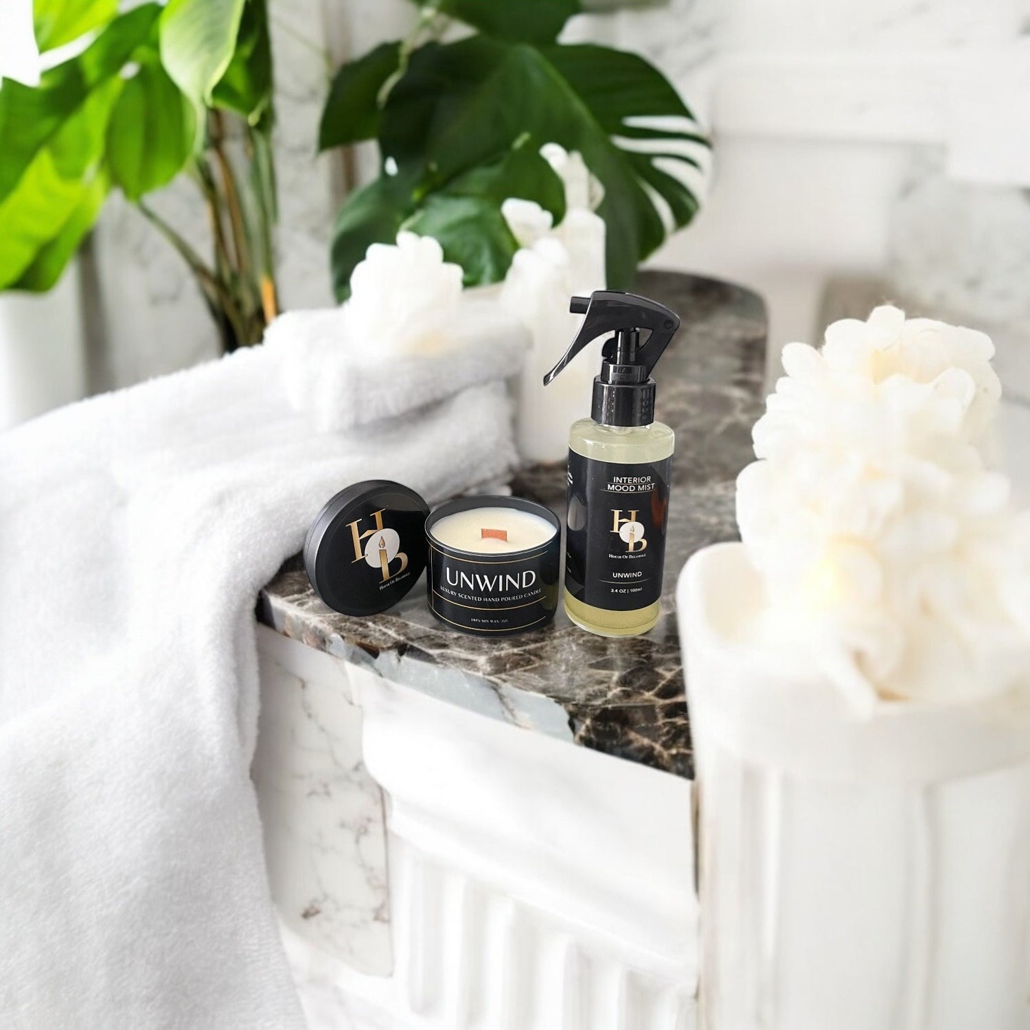 Room mists and soy candles styled in a cosy home interior to create a peaceful sanctuary, inspiring calm, relaxation, and well-being through natural home fragrance and elegant decor.