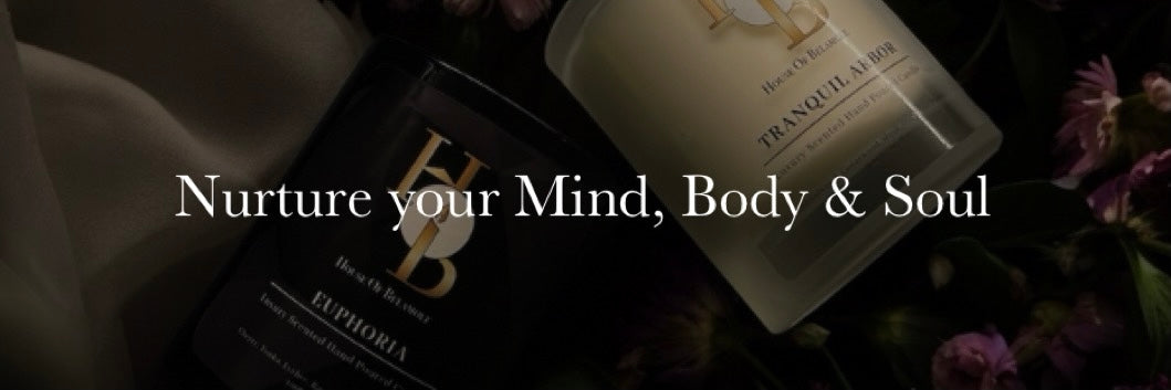 Luxury 2-wick scented soy candles with floral woody and fruity spicy scent notes, styled to highlight sophisticated home interiors and showcase calming home fragrance as part of elevated décor.