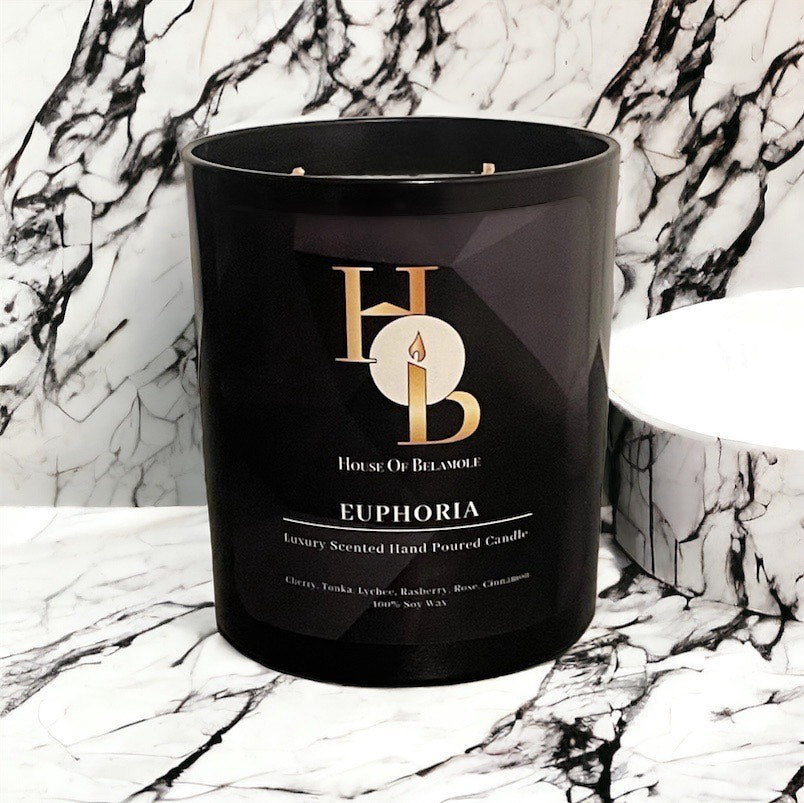 Euphoria scented soy candle with fruity spicy notes of cherry and cinnamon, crafted for relaxing home fragrance and luxury decor styling.