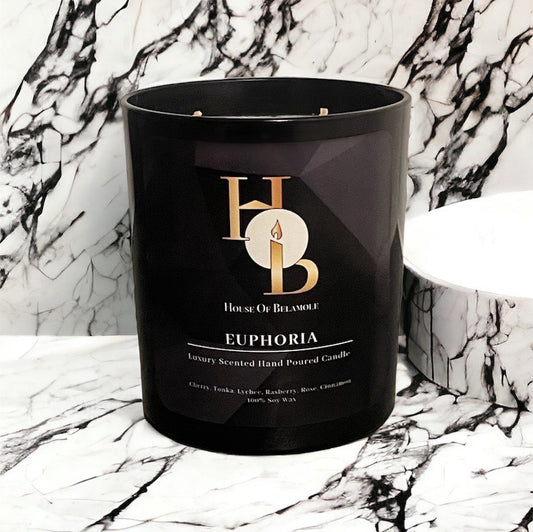 Euphoria scented soy candle with fruity spicy notes of cherry and cinnamon, crafted for relaxing home fragrance and luxury decor styling.