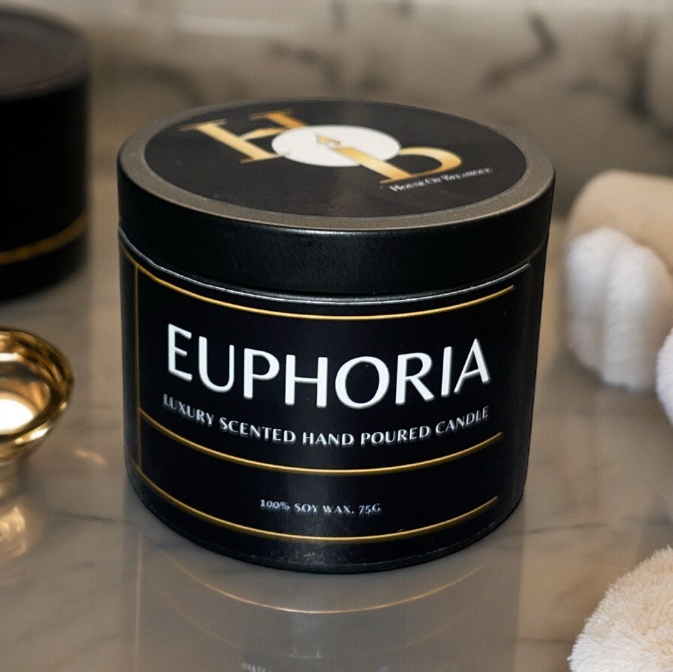Euphoria woodwick soy candle benefits shown: crackling woodwick, fruity spicy scent, uplifting home fragrance, and premium home decor and interior styling appeal.