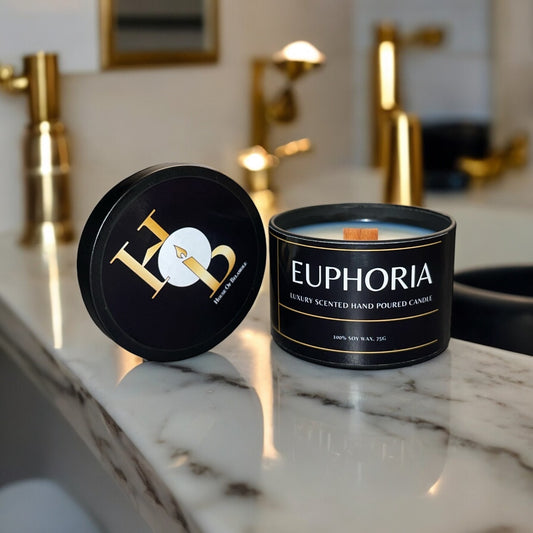 Euphoria woodwick soy candle with fruity spicy cherry, raspberry, and cinnamon notes, crafted for uplifting home fragrance and modern decor styling.