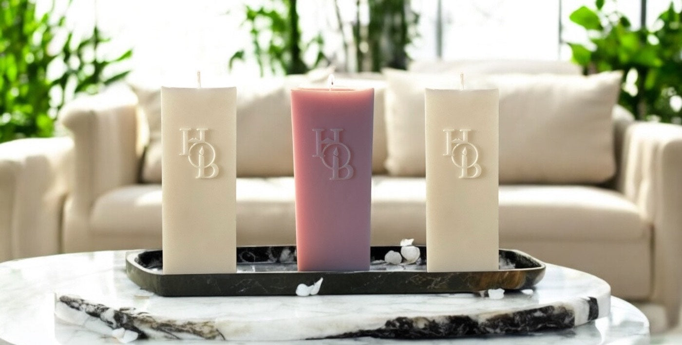 Scented soy pillar candle styled in a luxury home, perfect for elegant home styling and calm ambiance.