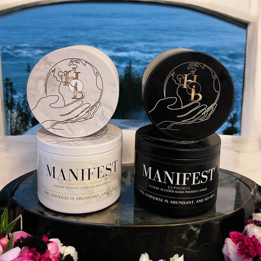 Manifest Candle in Tranquil Arbor and Euphoria with calming floral woody notes of oudh rose, sandalwood, and vanilla, designed to inspire intentional living, well-being and fill the home with relaxing luxury fragrance.