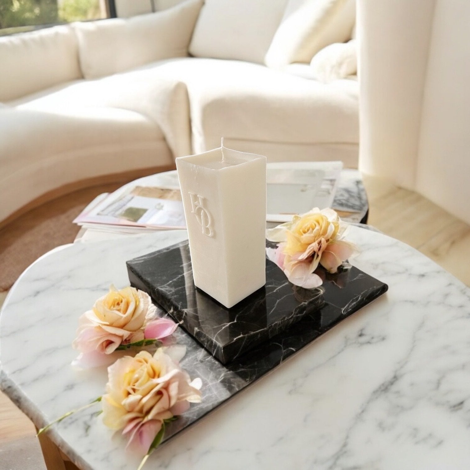 Unwind-scented pillar candle standing elegantly on a living room coffee table for restful sleep and relaxation.