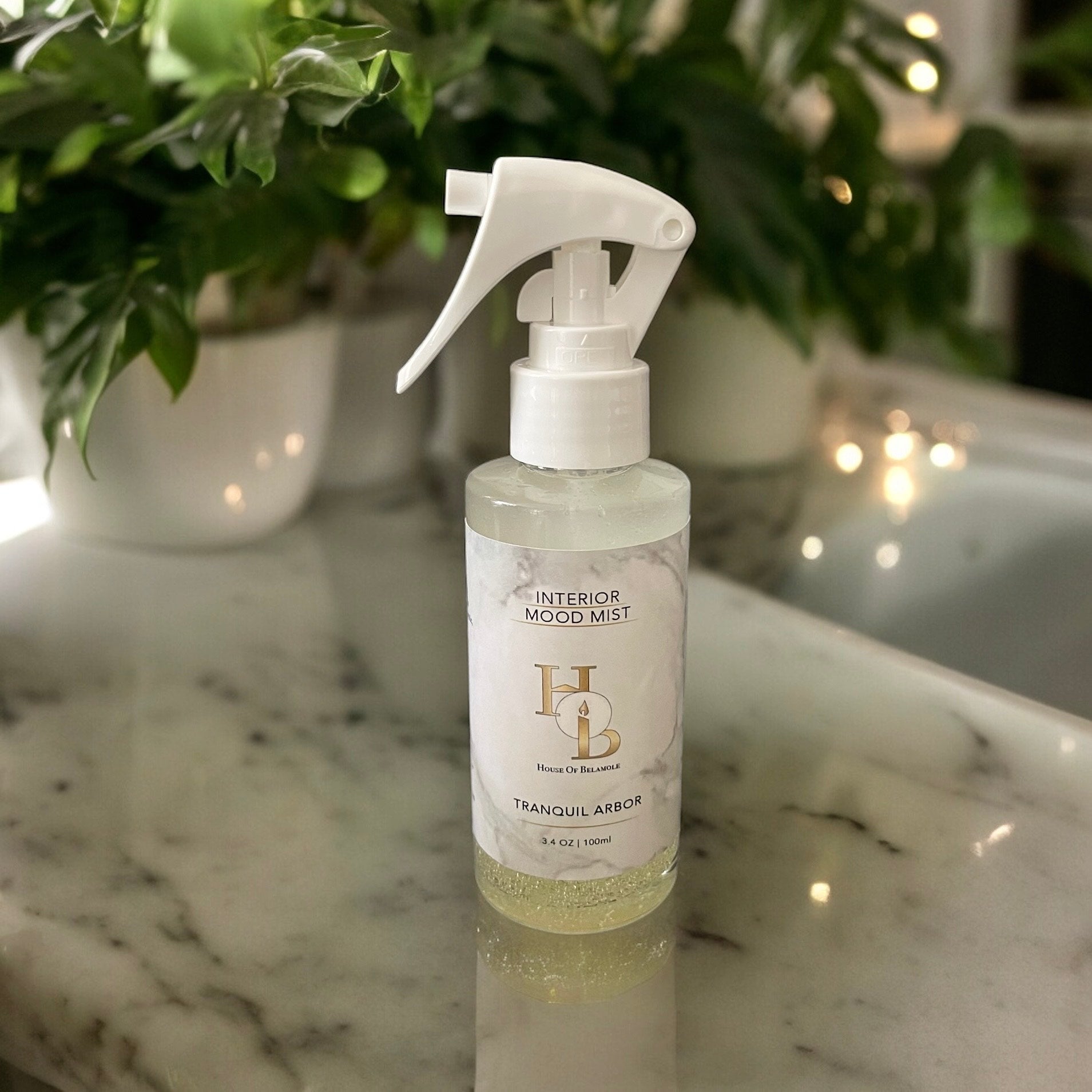 Alcohol-free Tranquil Arbor room mist with oudh rose, sandalwood, and vanilla, offering a grounding floral woody scent for relaxing, natural home fragrance.