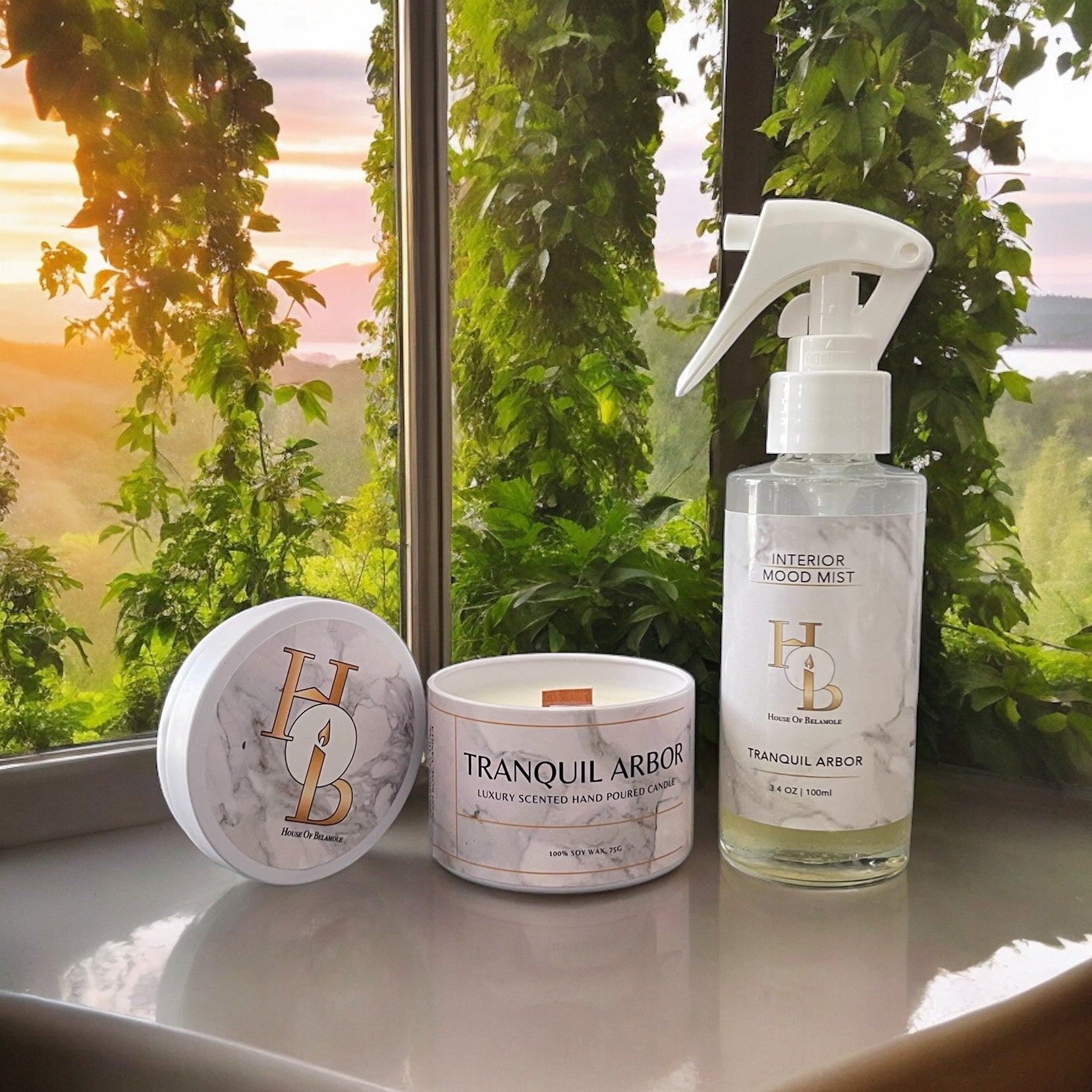 Tranquil Arbor alcohol-free room mist and woodwick soy candle styled in a luxury home setting, offering a calming oudh-based floral woody scent with a soothing crackle and elegant home fragrance ambiance.