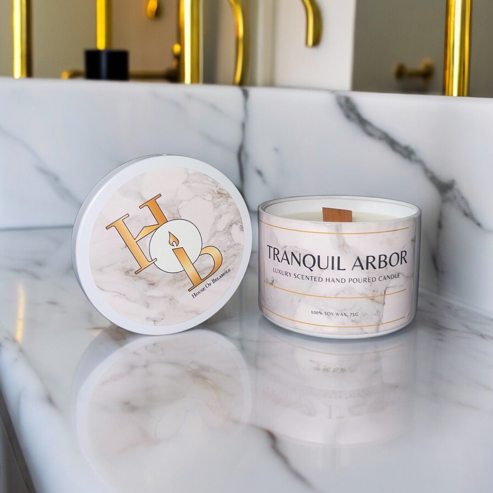 Tranquil Arbor woodwick soy candle with floral woody notes of oudh rose, sandalwood, and vanilla, crafted to provide calming home fragrance and elegant decor styling.