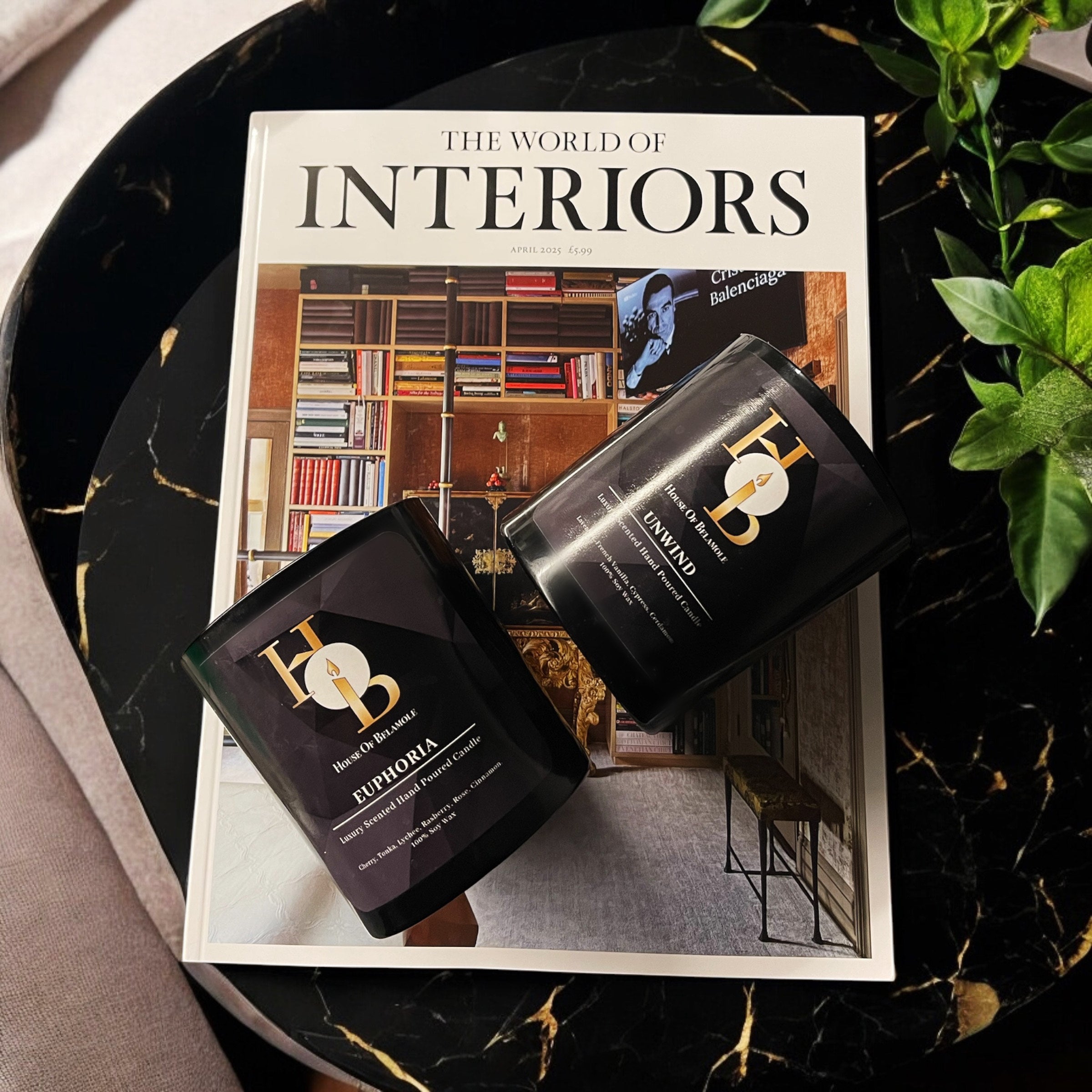 Luxury 2-wick soy candles styled on a high-end interiors magazine, showcasing calming home fragrance with fruity spicy and floral woody scent notes — perfect for elegant home decor and well-being rituals.