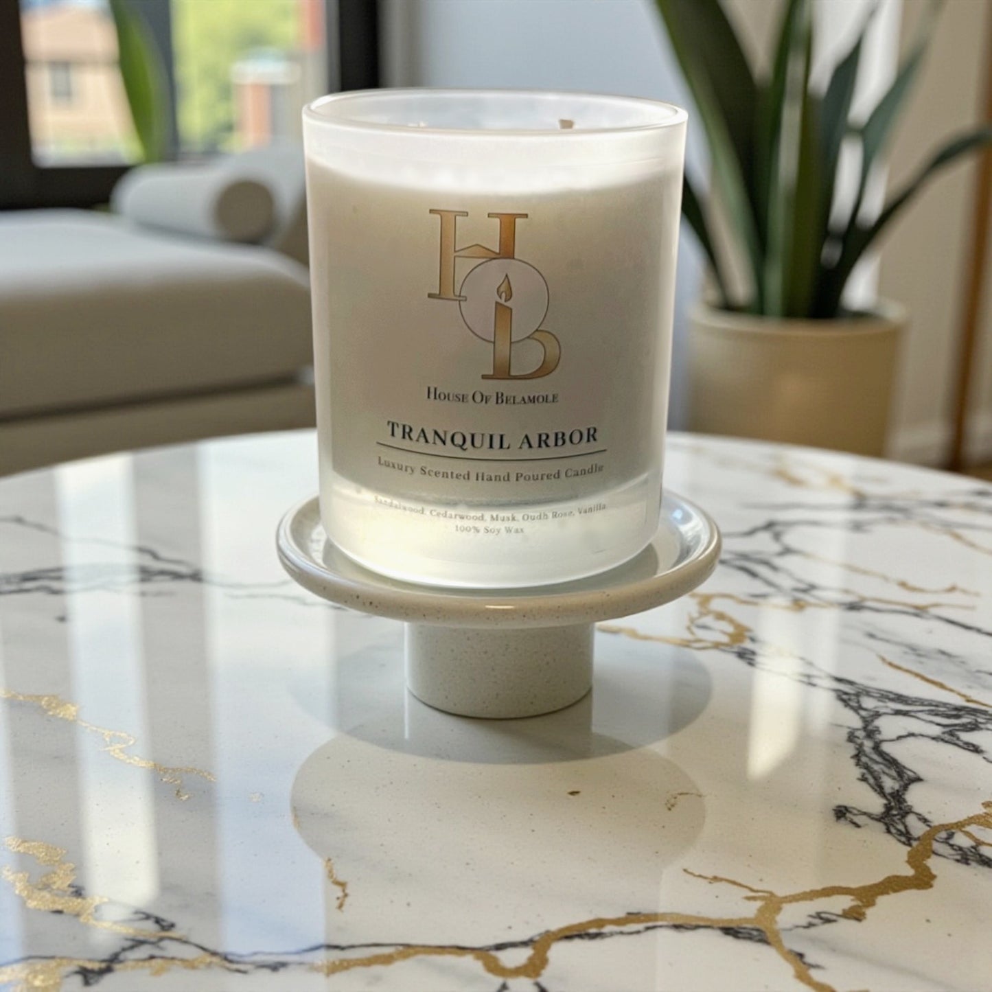 
Tranquil Arbor scented soy candle with calming floral woody notes of oudh rose, sandalwood, and cedarwood, crafted for grounding home fragrance and elegant interior decor.