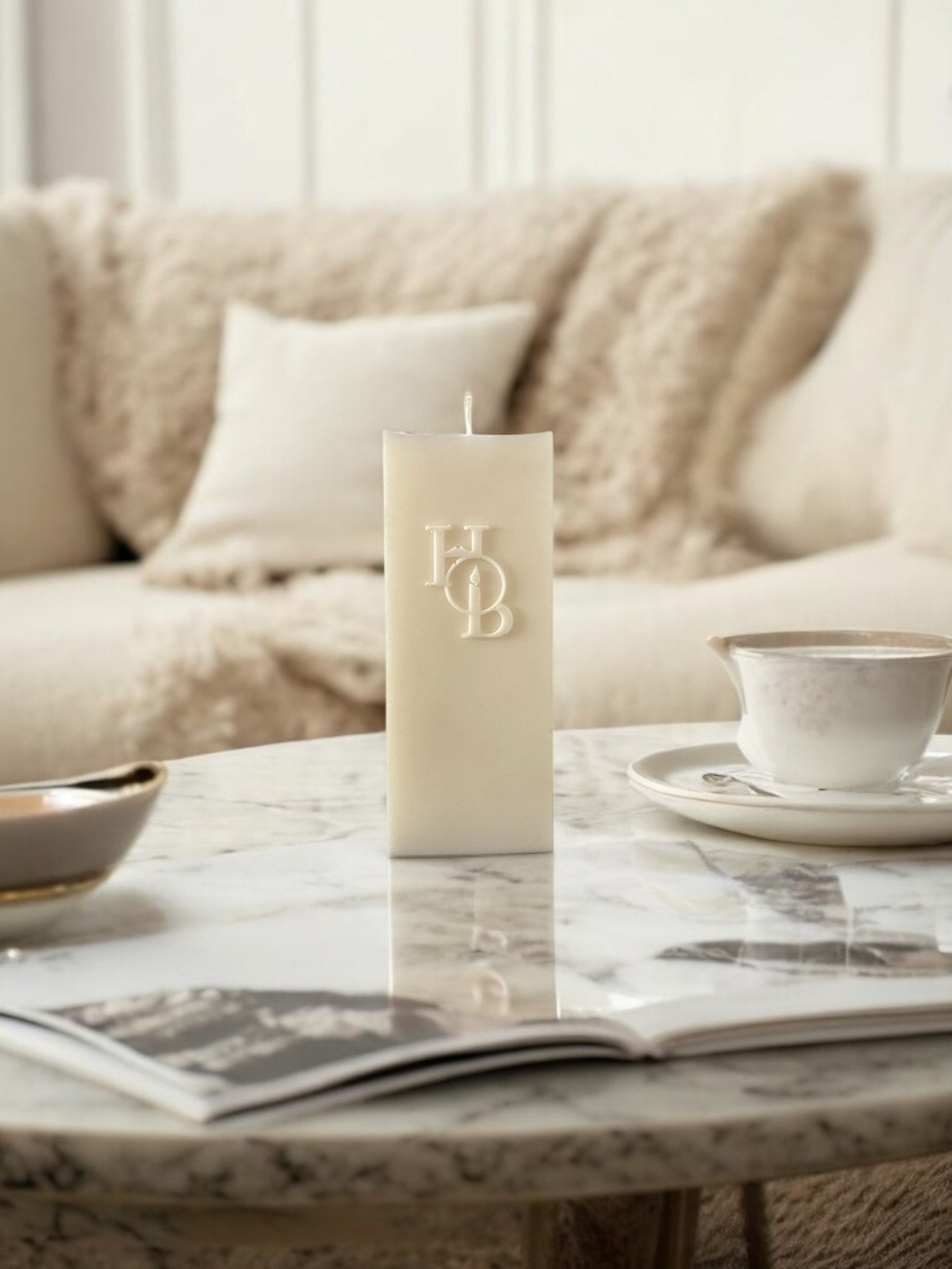 Unique embossed pillar candle styled as a sculptural home décor piece, hand-poured to complement luxury interiors while adding warmth, texture, and calming ambiance to any space.